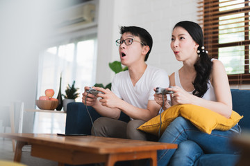 asian marry couple play game try to win each other family competition ideas concept