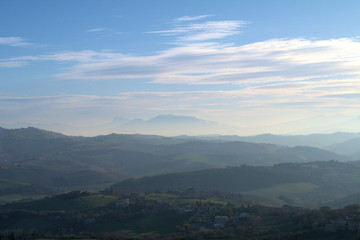 view of mountains and clouds,landscape,scenic,clouds,view,mist,hills,horizon,panorama