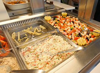 self service restaurant with many raw and cooked foods