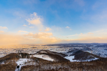 Beautiful landscape with moiwa mountain around tree in snow winter season at sunset time
