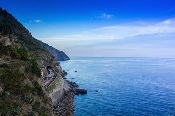 Fototapeta na wymiar Train station of Manarola, in the Cinque Terre national Park, Italy. Railway with views of the sea and the lovely evening landscape.