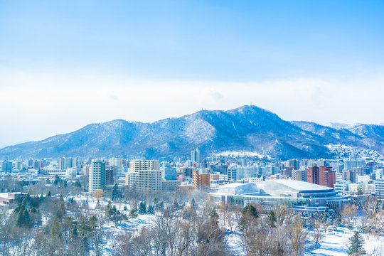 Beautiful architecture building with mountain landscape in winter season Sapporo city Hokkaido Japan