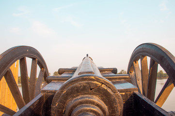 A closeup on the back of  Thai ancient artillery gun pointing to the sky 