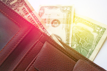 American dollars in the wallet on white background. Money and finance concept