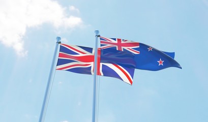New Zealand and UK, two flags waving against blue sky. 3d image