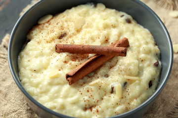 Classic rice pudding with cinnamon and almond nuts. healthy breakfast