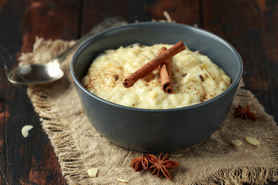 Classic rice pudding with cinnamon and almond nuts. healthy breakfast