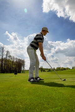 Man playing golf at sunny day, filtered image
