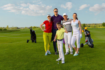 Obraz na płótnie Canvas Friends golfers with kid happy to finish their golf game