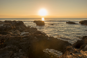Fototapeta premium A sunrise between the rocks of Oropesa del Mar