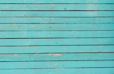 wooden background, old wooden wall, painted blue, with slits and nails