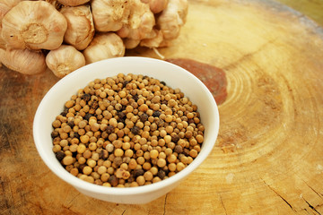Garlic, pepper and dry chili main ingredient of cooking Thai food preparation by blending and mixing in stone mortar and mix in meat, pork or chicken for cooking Thai curry, have space for write wordi