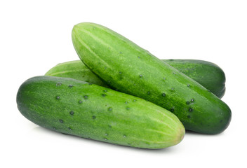 three whole cucumbers isolated on white background