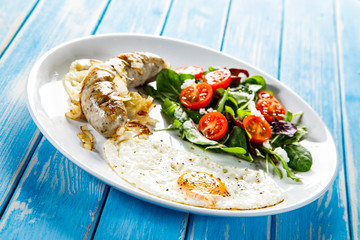 English breakfast - fried egg,sausage and vegetables