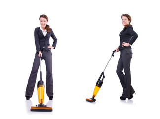 Young woman with vacuum cleaner on white