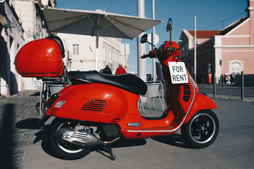 Fototapeta na wymiar Retro Red Scooter Bike Motorbike for Rent
