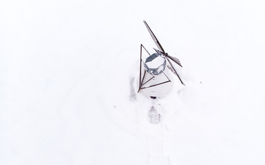 old windmill in a snowy field on Estonain countryside