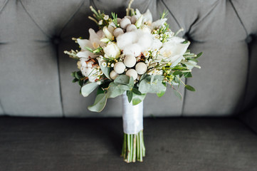 Winter wedding bouquet on a gray background