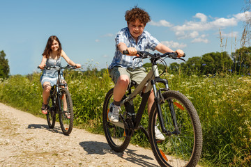 Fototapeta premium Urban biking - kids riding bikes