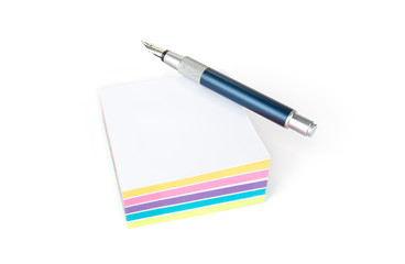 Pile of sticky note on a white background with a pen
