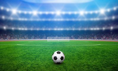 Plakat Soccer ball on green stadium