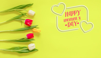 Obraz premium Happy Women's Day. Spring tulips on background. International Women's day.