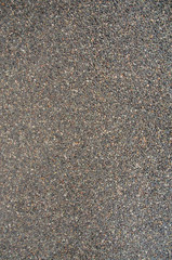 Small pebble rock on ground as background.