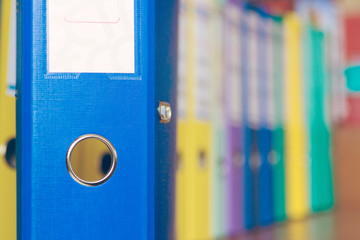A row of binders for documents in the office