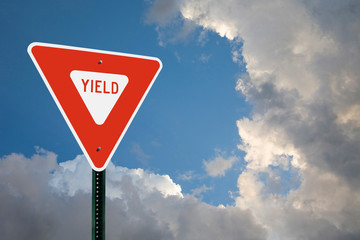 Yield Sign With Storm Clouds