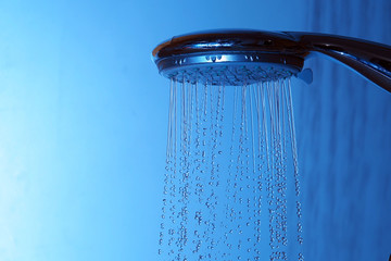 Fototapeta na wymiar Water flows from the shower