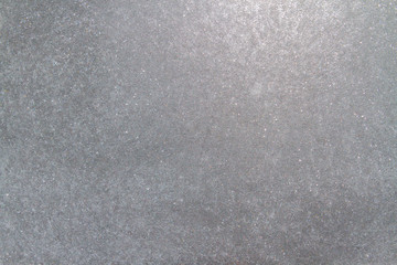 Frozen window photographed in the evening with a flicker of color