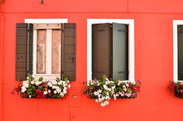 Abstract colorful windows on the island of Burano Venice Italy. Colorful concept, red and pink