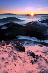 Fototapeta premium Fantastic evening and morning winter landscape. Colorful overcast sky. Beauty world Magical snow covered tree. In anticipation of the holiday. Dramatic wintry scene. Carpathian mountains, Europe
