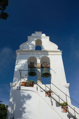 the white belfry of the Greek church 