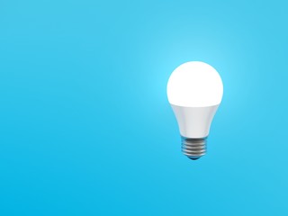 Light bulb on blue background. E 27. 3d illustration.