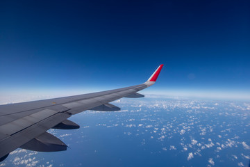 Aeroplane wing view from window beautiful sky. Traveling concept