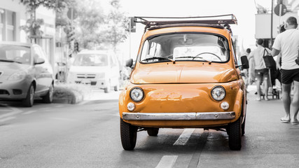 Old yellow car on the little Italy streets