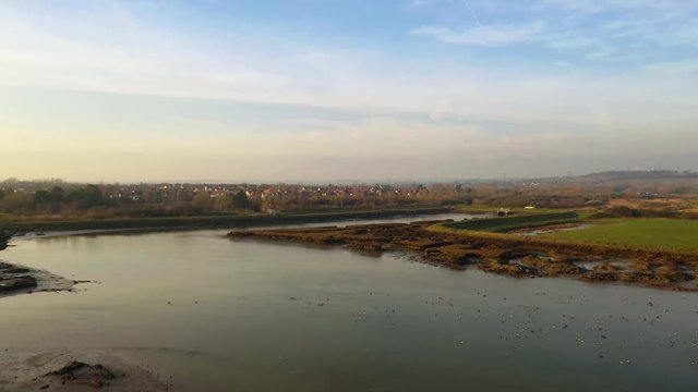 Aerial sequence depicting the wetlands at Hawbush Creek, South Woodham Ferrers with its diverse wildlife and waterfowl. Popular with walkers, visitors and naturalists alike.
