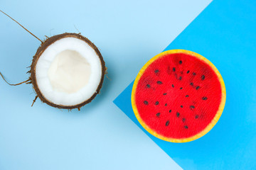 cocnut and swuishy toy melon on a blue background
