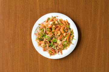 Traditional Turkish Kebab Salad onions and tomatoes in plate on wooden table