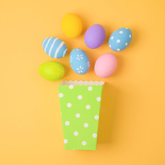 Easter holiday concept with easter eggs and paper box. Minimal concept.