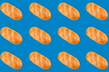 Horizontal rows of whole baked breads on blue background. Seamless pattern