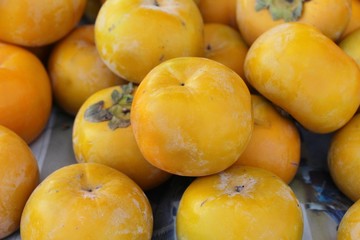 Naklejka na ściany i meble Persimmon fruit is delicious at street food