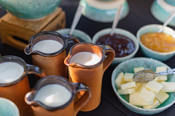 Milk, jam and butter. Idea for breakfast 