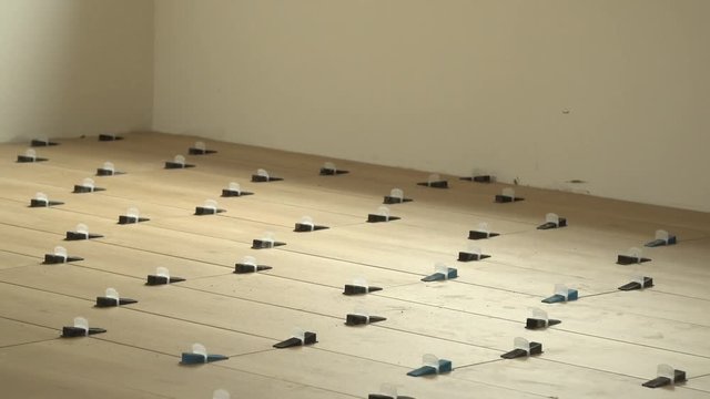 New tile floor set during home renovation, zooming out slowly