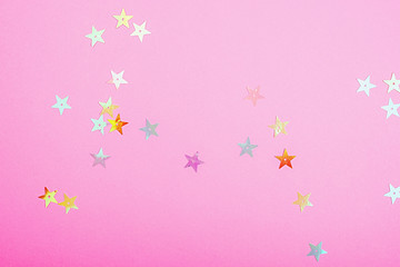 Bright plastic pink color with small shiny stars. Brilliant background for your festive project