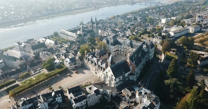View from drone of French city of Blois with Royal Chateau and church of St. Nicolas in sunny autumn day