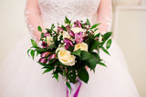 Bride holding her bouquet, closeup