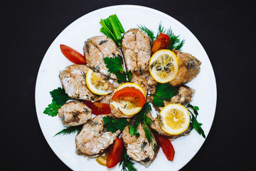 Baked salmon fish fillet with tomatoes,spices., lemon. Diet menu. Top view. Healthy food seafood