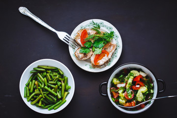 selection of healthy food on a black background
